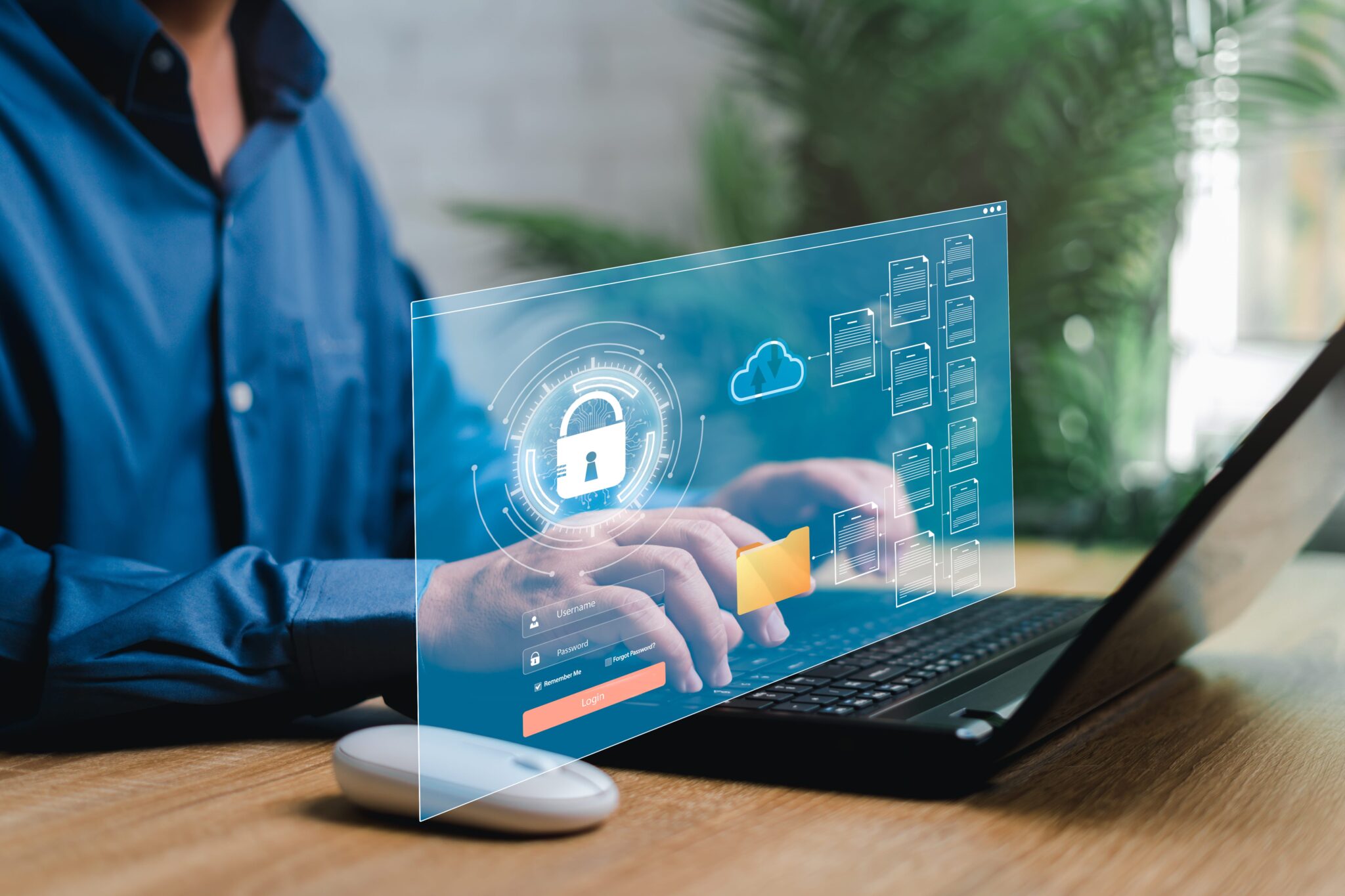 Datensicherheit am Arbeitsplatz: Person nutzt Laptop für sicheren Zugang in digitalem Netzwerk.